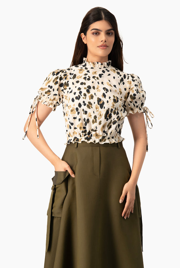 Blusa estampada cuello alto