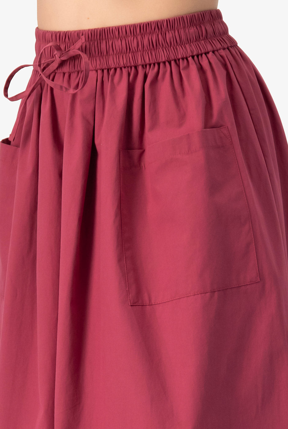 Falda midi rosa obscuro con bolsillos y cintura elástica