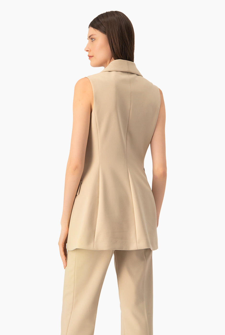 Chaleco largo beige con solapa y bolsillos de cartera