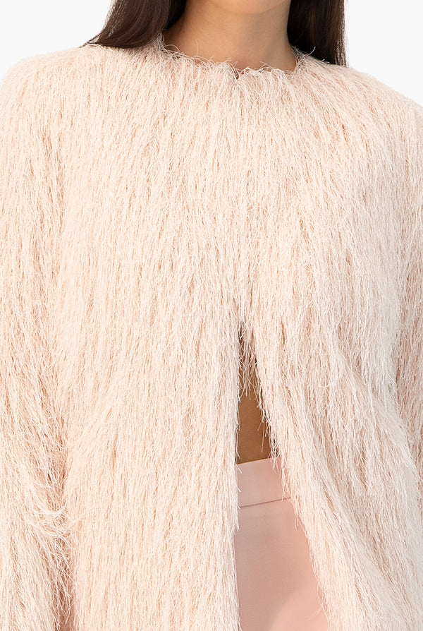 Abrigo de flecos con broches