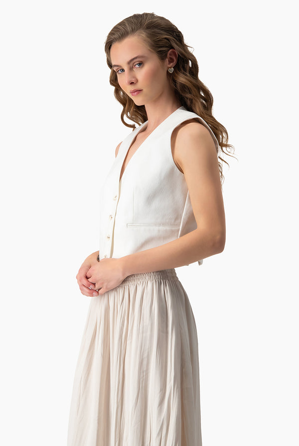 Chaleco marfil bolsillos simulados