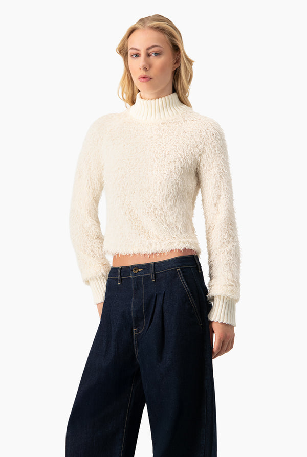 Blusa de flecos y manga larga