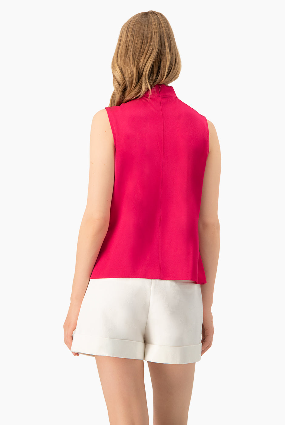 Blusa fucsia sin mangas con cuello lazo de Ivonne