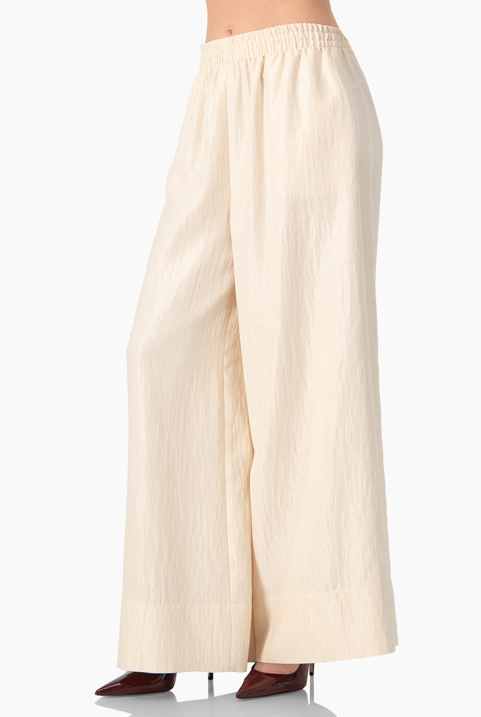 Pantalón amplio natural con cintura elástica y dobladillo suelto