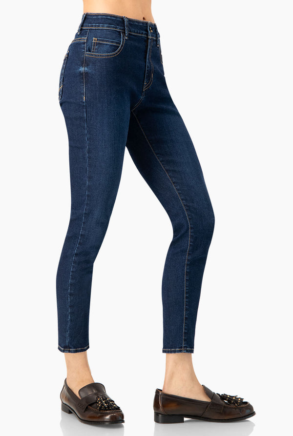 Jeans skinny con un boton frontal