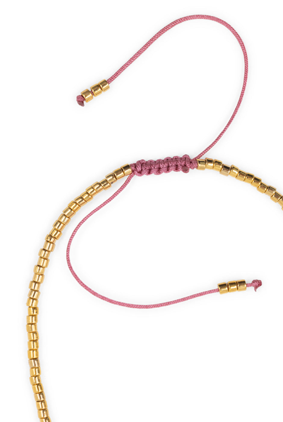 Pulsera ajustable de cuentas doradas y rosas con dije de corazón.