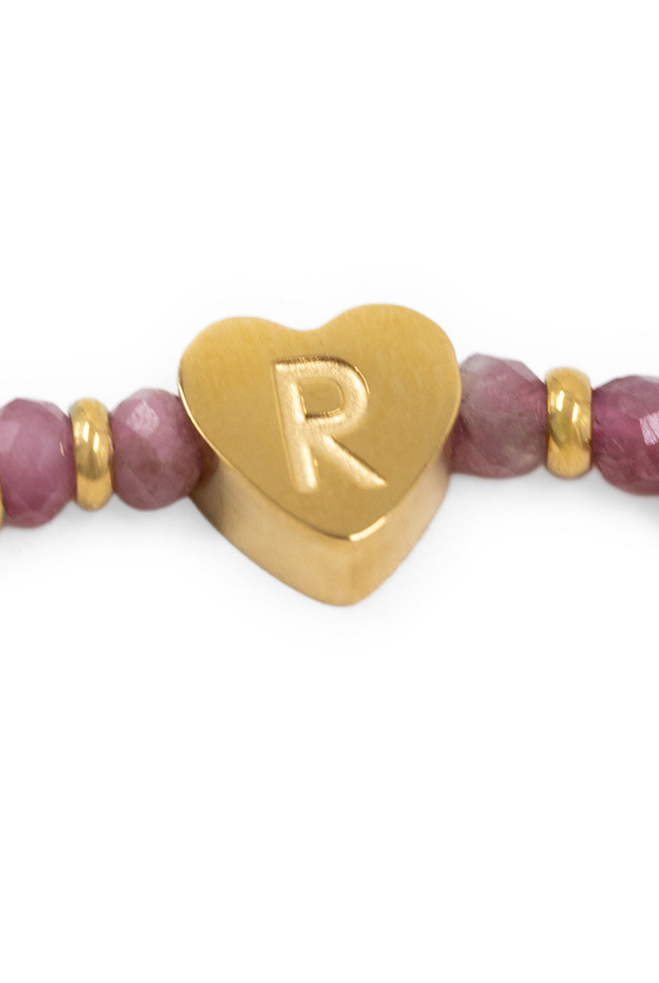 Pulsera ajustable de cuentas doradas y rosas con dije de corazón.